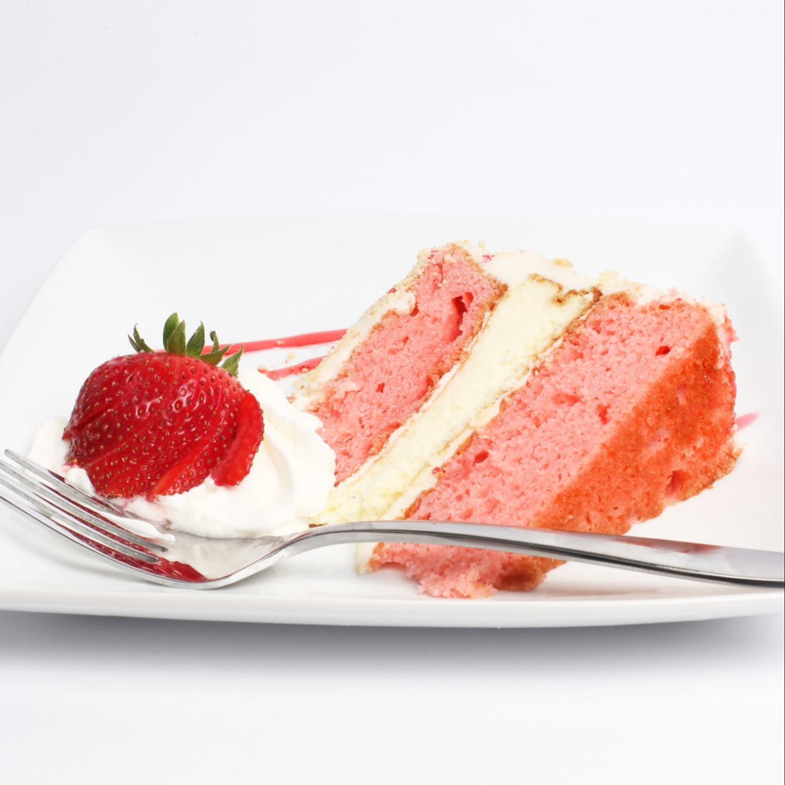A slice of fresh strawberry cake by Cakes by Keon